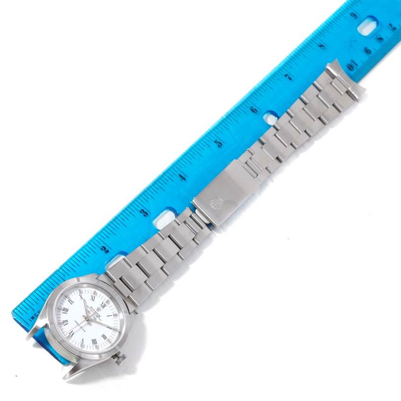 The image shows a Rolex Air-King 14010 Men's Stainless Steel White Dial 14010 Men's Stainless Steel White Dial watch laid flat beside a ruler, displaying the watch face, bracelet, and clasp.