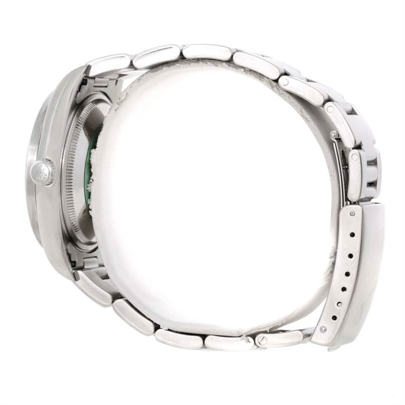 This side-angle view of the Rolex Air-King 14010 Men's Stainless Steel White Dial 14010 Men's Stainless Steel White Dial watch shows its bracelet and partially its case with the crown.