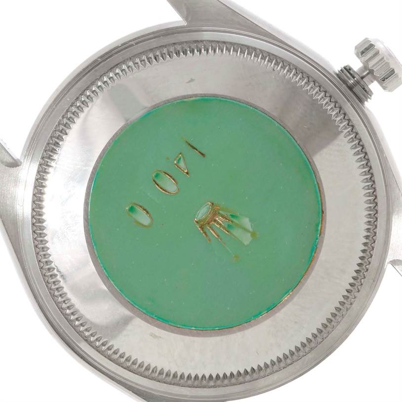 This image shows the back case and crown of a Rolex Air-King 14010 Men's Stainless Steel White Dial 14010 Men's Stainless Steel White Dial watch at an angled view.