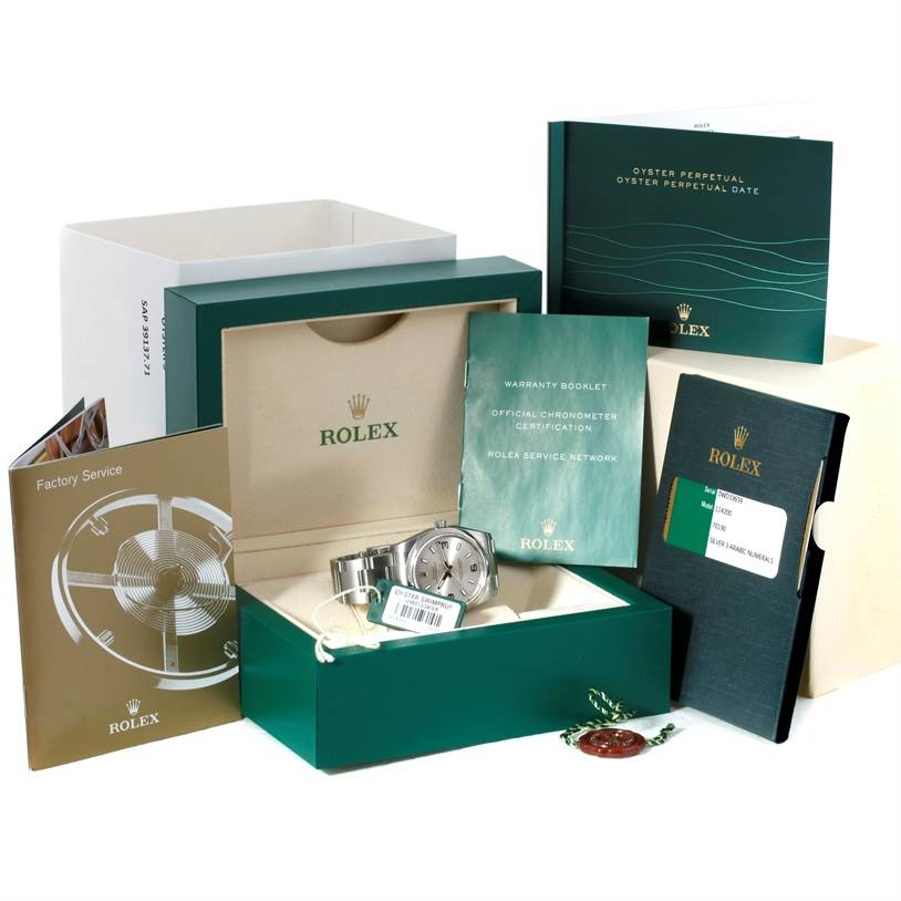 This image shows an unboxed Rolex Air-King 114200 Men's Stainless Steel Silver Dial 114200 Men's Stainless Steel Silver Dial watch with various accessories, including manuals, a warranty booklet, and tags.