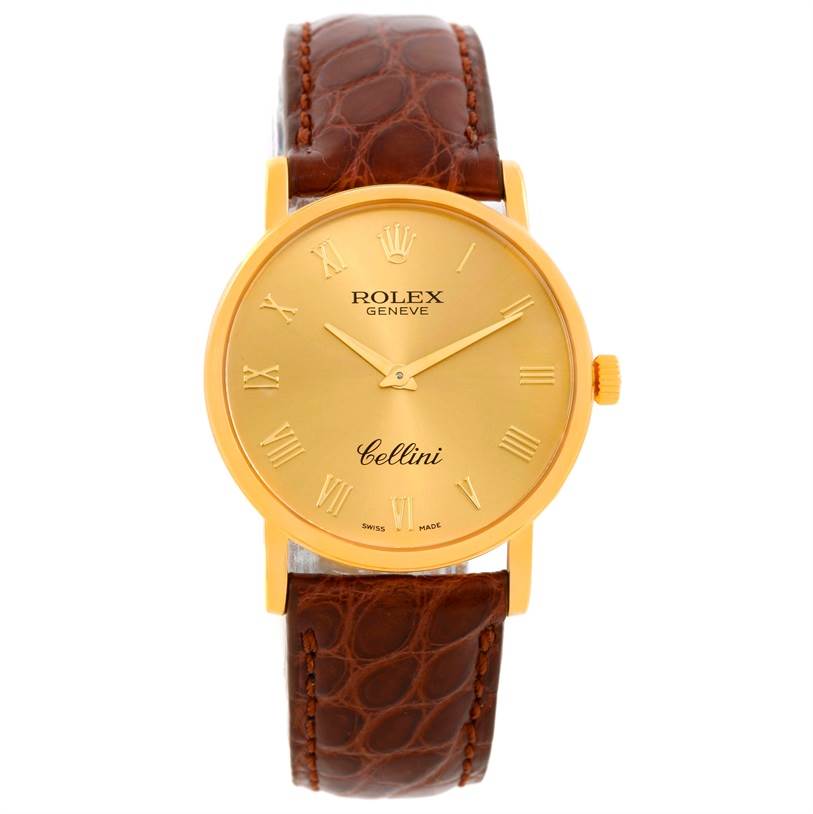 The image shows a front view of a Rolex Cellini 5115 Men
s Yellow Gold Champagne Dial 5115 Men
s Yellow Gold Champagne Dial watch with a gold case and a brown leather strap.