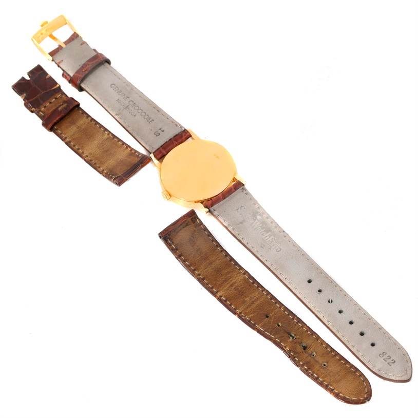 This Rolex Cellini 5115 Men
s Yellow Gold Champagne Dial 5115 Men
s Yellow Gold Champagne Dial model watch is shown from the back, displaying the leather strap and metal case.