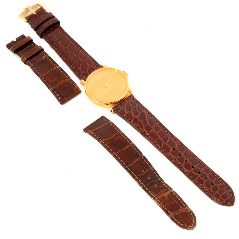 The image shows a Rolex Cellini 5115 Men
s Yellow Gold Champagne Dial 5115 Men
s Yellow Gold Champagne Dial watch with a brown leather strap, placed next to an additional brown leather strap.