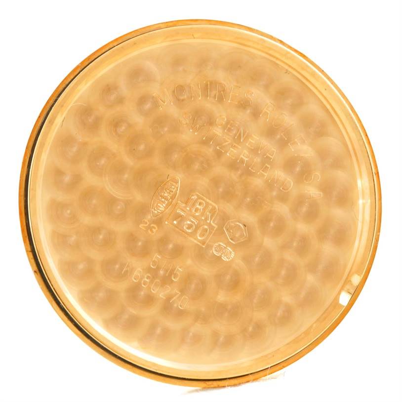 This is the internal view of the Rolex Cellini 5115 Men
s Yellow Gold Champagne Dial 5115 Men
s Yellow Gold Champagne Dial watch case back, showcasing the engravings and markings.