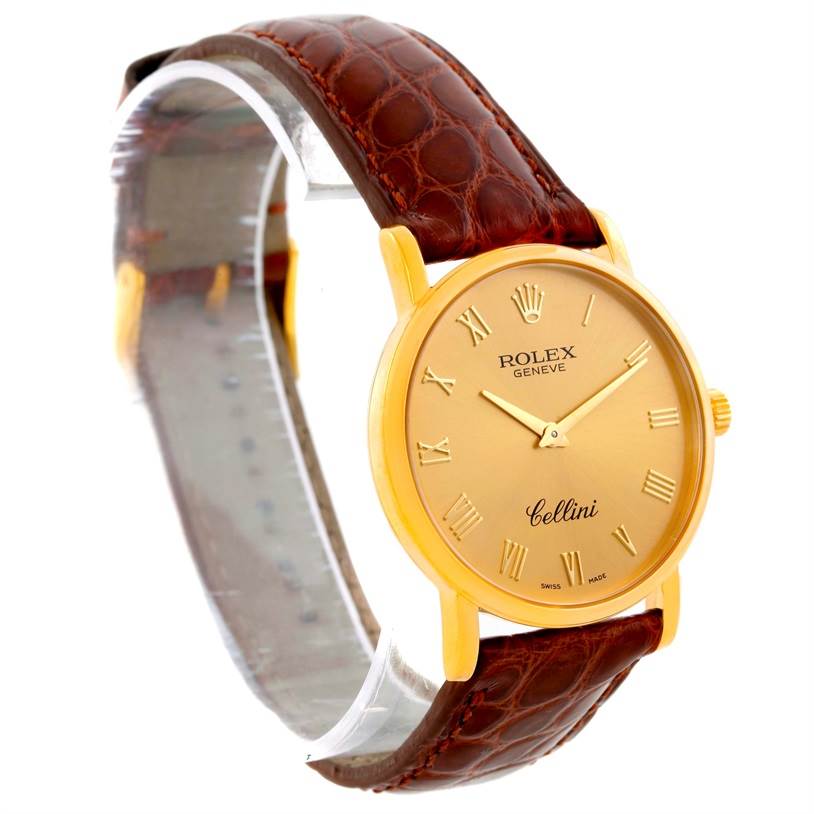 The Rolex Cellini 5115 Men
s Yellow Gold Champagne Dial 5115 Men
s Yellow Gold Champagne Dial watch is shown at an angle displaying the dial, case, and leather strap.