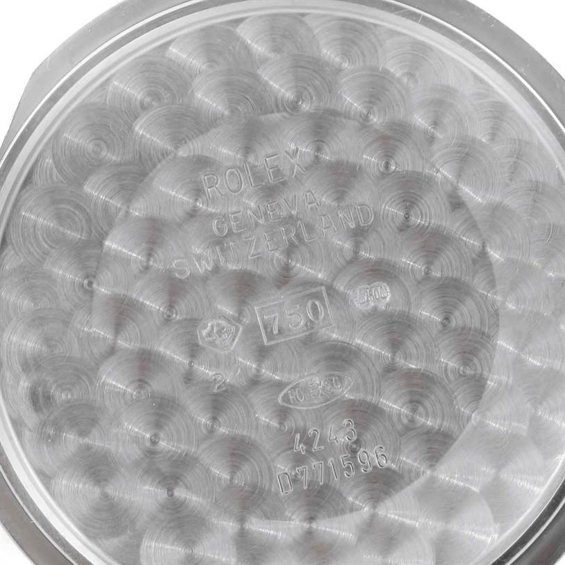 This is the inner side of the case back of a Rolex Cellini 4243 Men's White Gold Black Dial 4243 Men's White Gold Black Dial watch, showing engravings and hallmarks.