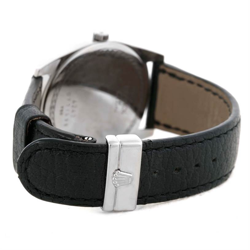 The image shows the back view of a Rolex Cellini 4243 Men's White Gold Black Dial 4243 Men's White Gold Black Dial watch, focusing on the leather strap and metal clasp with the Rolex logo.