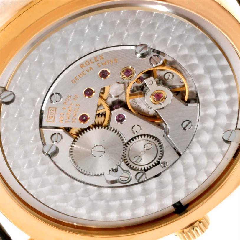 This image shows the intricate inner mechanical parts of a Rolex Cellini 4243 Men's Yellow Gold White Dial 4243 Men's Yellow Gold White Dial watch at an angled close-up view.