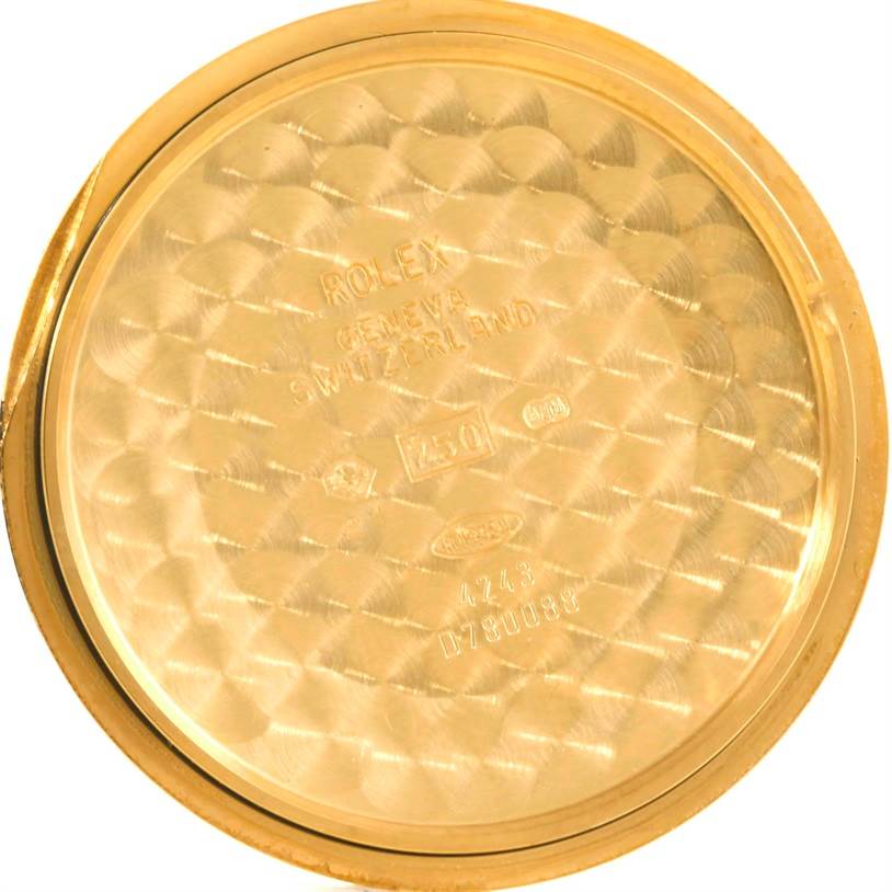 This image shows the inner case back of a Rolex Cellini 4243 Men's Yellow Gold White Dial 4243 Men's Yellow Gold White Dial watch, featuring inscriptions and the brand's hallmark.