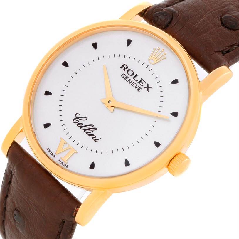 The image shows a close-up view of the Rolex Cellini 5115 Men
s Yellow Gold Silver Dial 5115 Men
s Yellow Gold Silver Dial watch, focusing on the face, crown, and part of the leather strap.