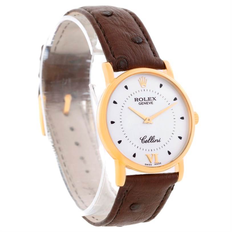 The Rolex Cellini 5115 Men
s Yellow Gold Silver Dial 5115 Men
s Yellow Gold Silver Dial watch is shown at an angled view, displaying its round dial, gold case, and brown leather strap.