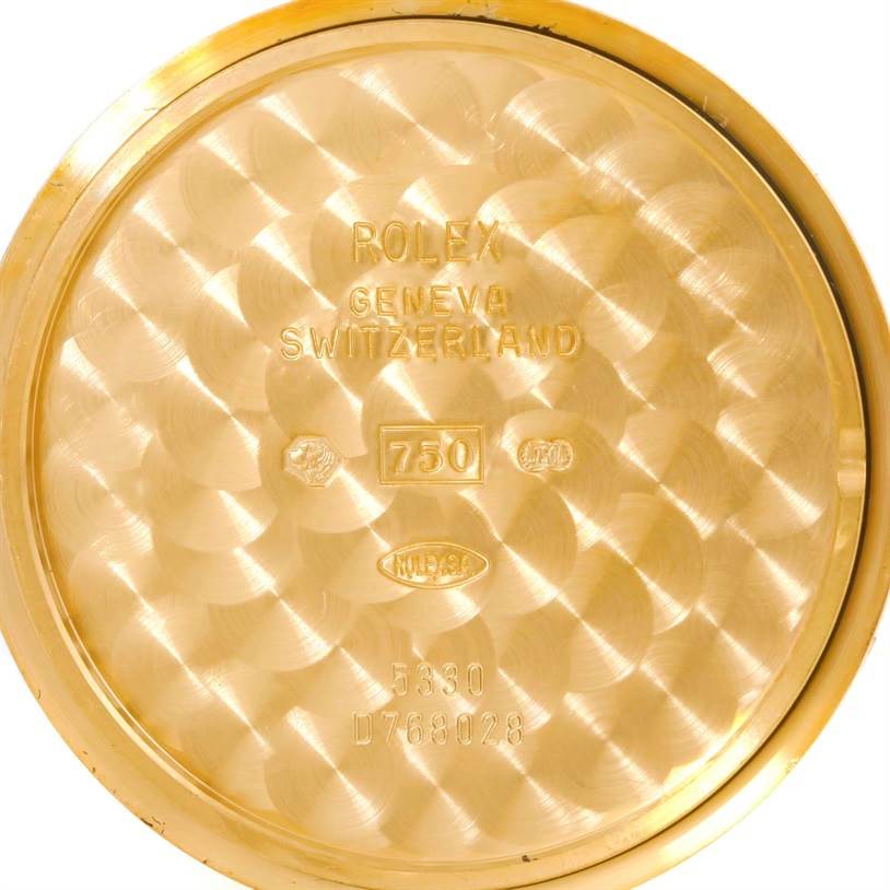 The image shows the inside back cover of a Rolex Cellini 5330 Men's Yellow Gold White Dial 5330 Men's Yellow Gold White Dial watch with engravings and hallmarks.