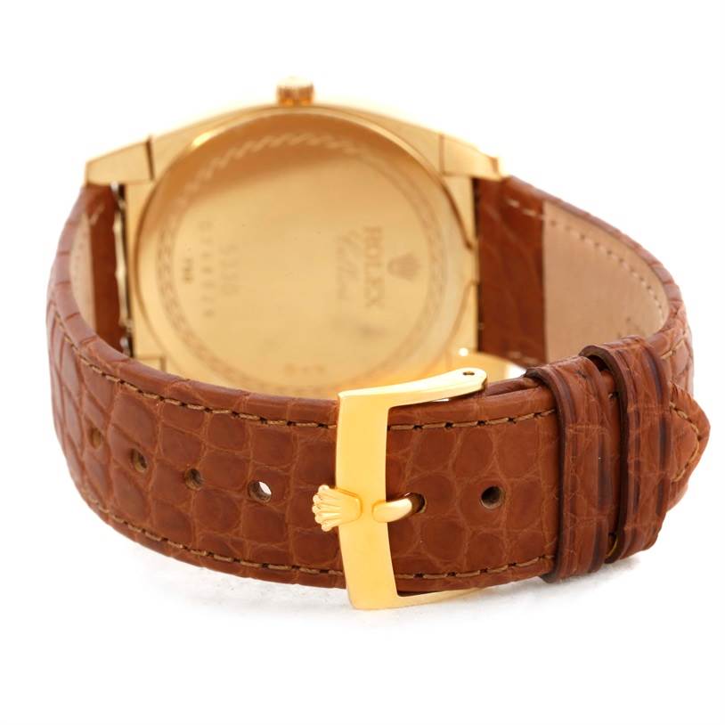 This image shows the back view of a Rolex Cellini 5330 Men's Yellow Gold White Dial 5330 Men's Yellow Gold White Dial watch, focusing on the leather strap and gold buckle.