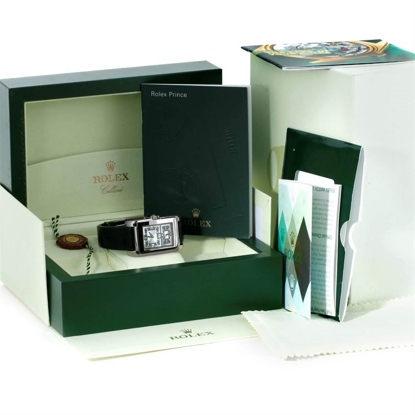 The image shows a Rolex Cellini 5443 Men's White Gold Black Dial 5443 Men's White Gold Black Dial watch from above, inside its box, along with manuals and additional accessories.