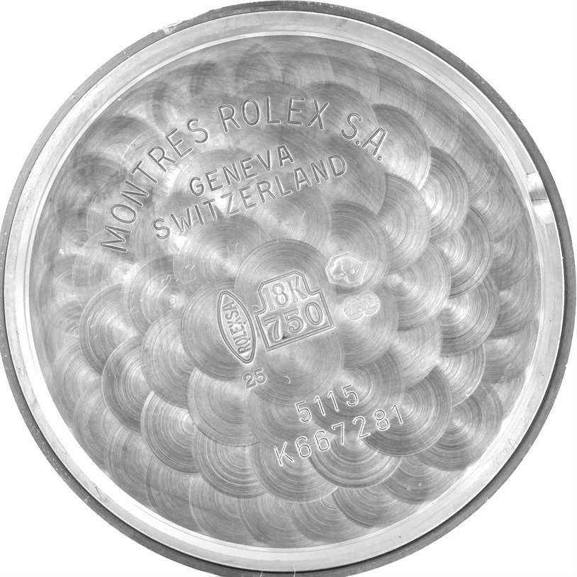 The image shows the inner case back of a Rolex Cellini 5115 Men's White Gold Silver Dial 5115 Men's White Gold Silver Dial watch, revealing engravings and material markings.