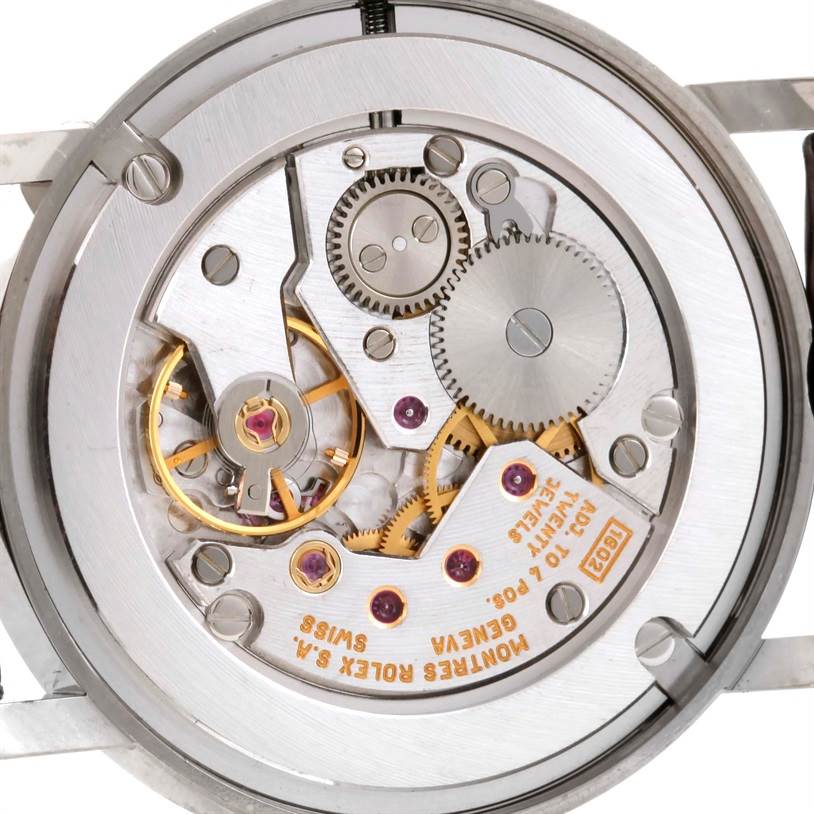 This image shows the internal mechanism of a Rolex Cellini 5115 Men's White Gold Silver Dial 5115 Men's White Gold Silver Dial watch, with gears and components visible from the back.