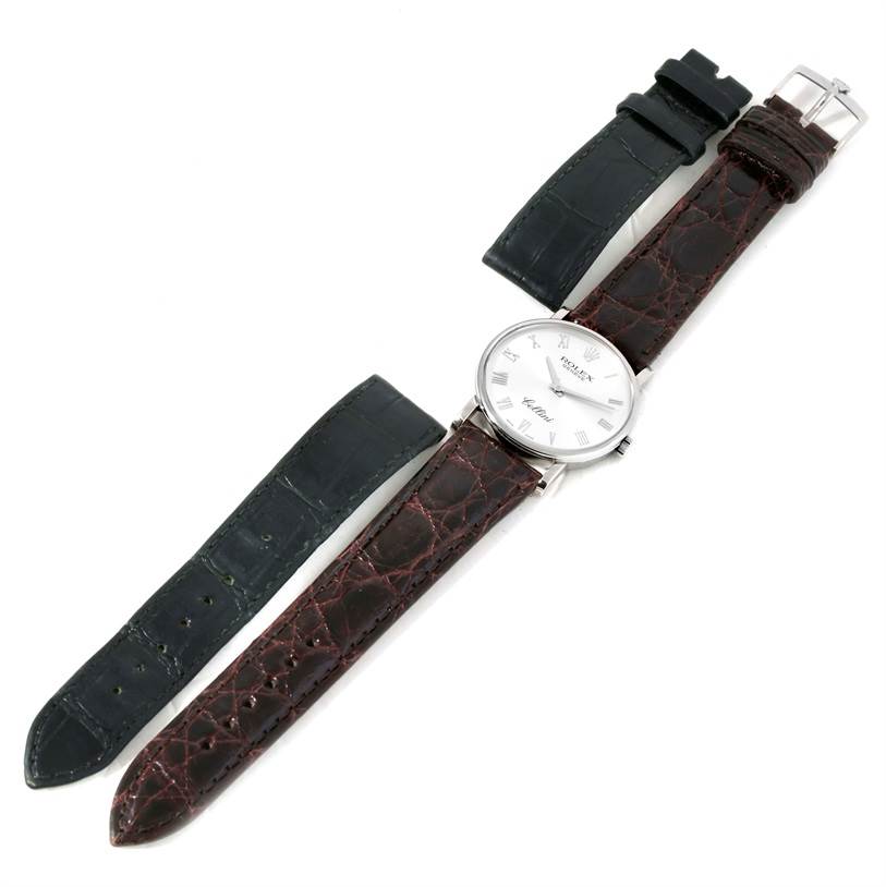 The image shows a Rolex Cellini 5115 Men's White Gold Silver Dial 5115 Men's White Gold Silver Dial watch at a top-down angle, displaying both the black and brown leather straps.