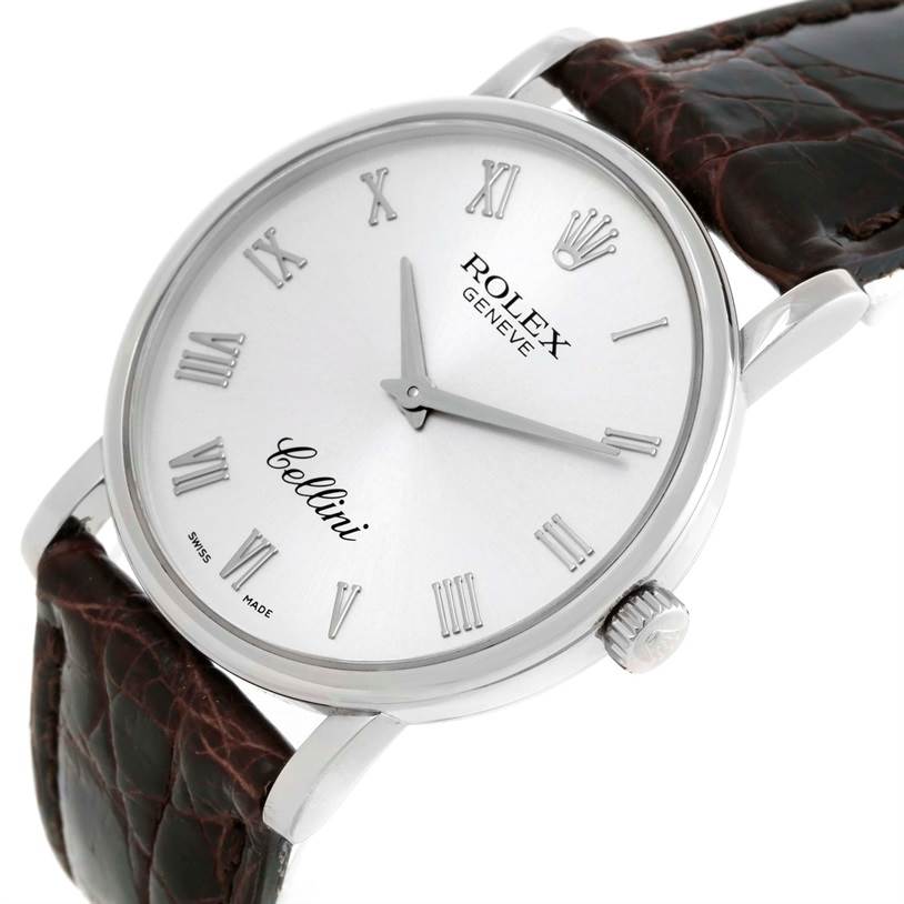 The image shows a close-up angled view of a Rolex Cellini 5115 Men's White Gold Silver Dial 5115 Men's White Gold Silver Dial watch, including the dial, crown, and part of the leather strap.