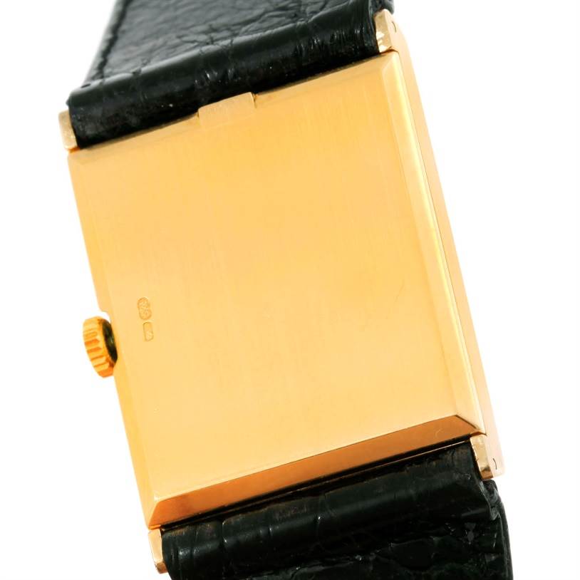 The photo shows the back case and side view of the Rolex Cellini 5071 Men's Yellow Gold Champagne Dial 5071 Men's Yellow Gold Champagne Dial watch, featuring its crown and black leather strap.