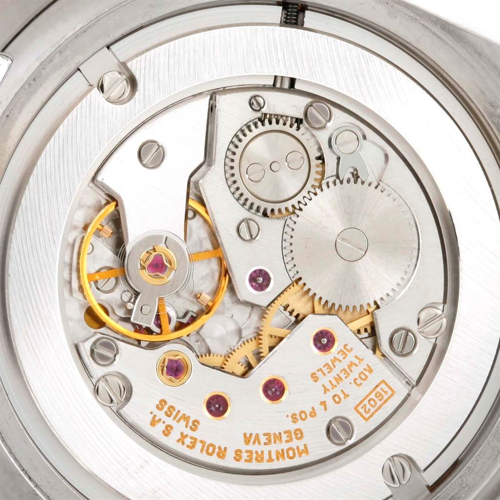 This close-up view shows the intricate inner mechanism of a Rolex Cellini 4233 Men's White Gold Black Dial 4233 Men's White Gold Black Dial model watch, highlighting the gears and components.