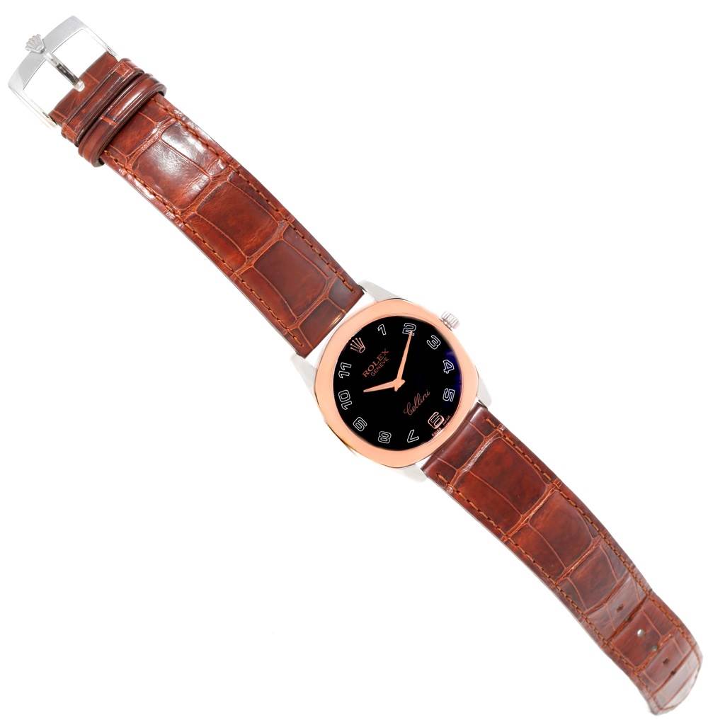 The Rolex Cellini 4233 Men's White Gold Black Dial 4233 Men's White Gold Black Dial watch is shown from a top-down angle, displaying the watch face, case, crown, and leather strap.