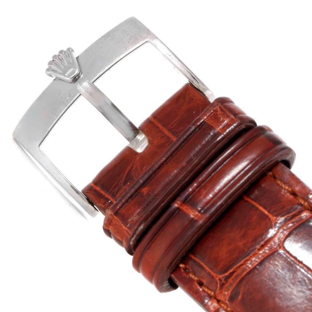 The image shows a close-up of the buckle and part of the leather strap for a Rolex Cellini 4233 Men's White Gold Black Dial 4233 Men's White Gold Black Dial watch.