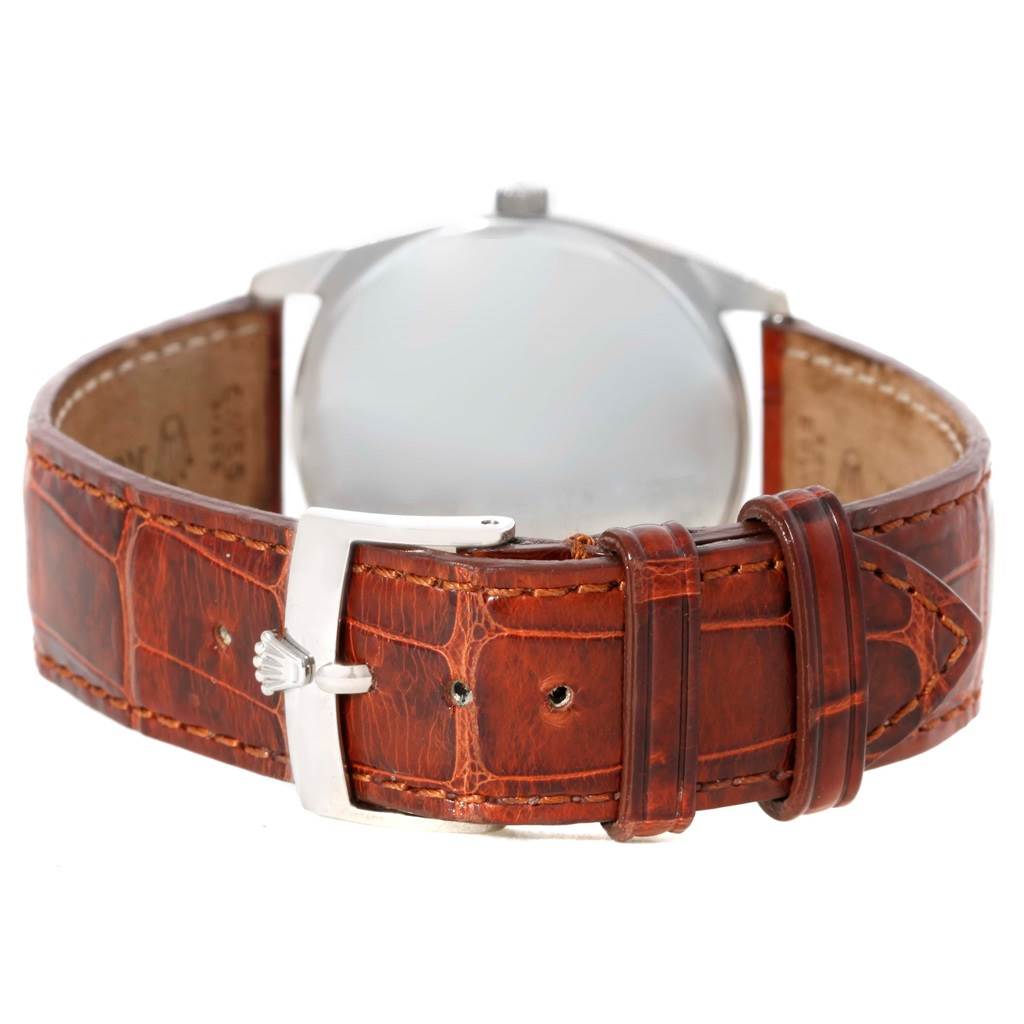 The image shows the back side and strap of a Rolex Cellini 4233 Men's White Gold Black Dial 4233 Men's White Gold Black Dial watch with a brown leather strap and a silver buckle.