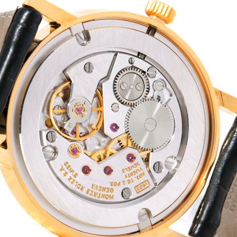 This image shows the intricate movement and inner mechanism of a Rolex Cellini 5115 Men
s Yellow Gold Mother of Pearl Dial 5115 Men
s Yellow Gold Mother of Pearl Dial watch, viewed from the back.