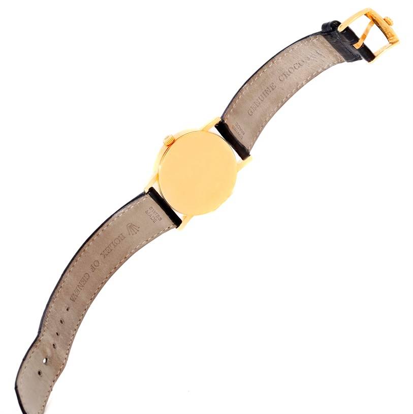 The image shows the backside and strap of the Rolex Cellini 5115 Men
s Yellow Gold Mother of Pearl Dial 5115 Men
s Yellow Gold Mother of Pearl Dial watch, displaying the case back and leather strap with buckle.