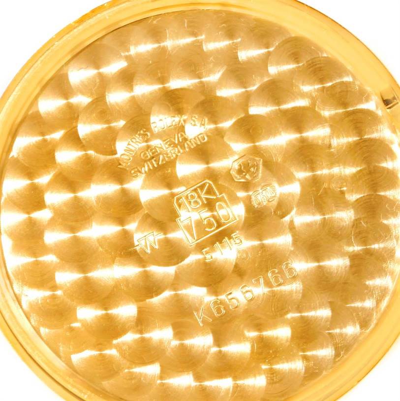 This is a close-up of the interior case back of a Rolex Cellini 5115 Men
s Yellow Gold Mother of Pearl Dial 5115 Men
s Yellow Gold Mother of Pearl Dial watch, showing the model number and gold markings.