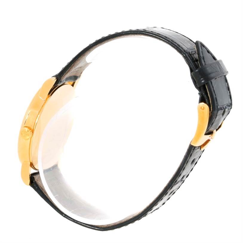 This is a side view of the Rolex Cellini 5115 Men
s Yellow Gold Mother of Pearl Dial 5115 Men
s Yellow Gold Mother of Pearl Dial model watch, showing its black leather strap and gold case.