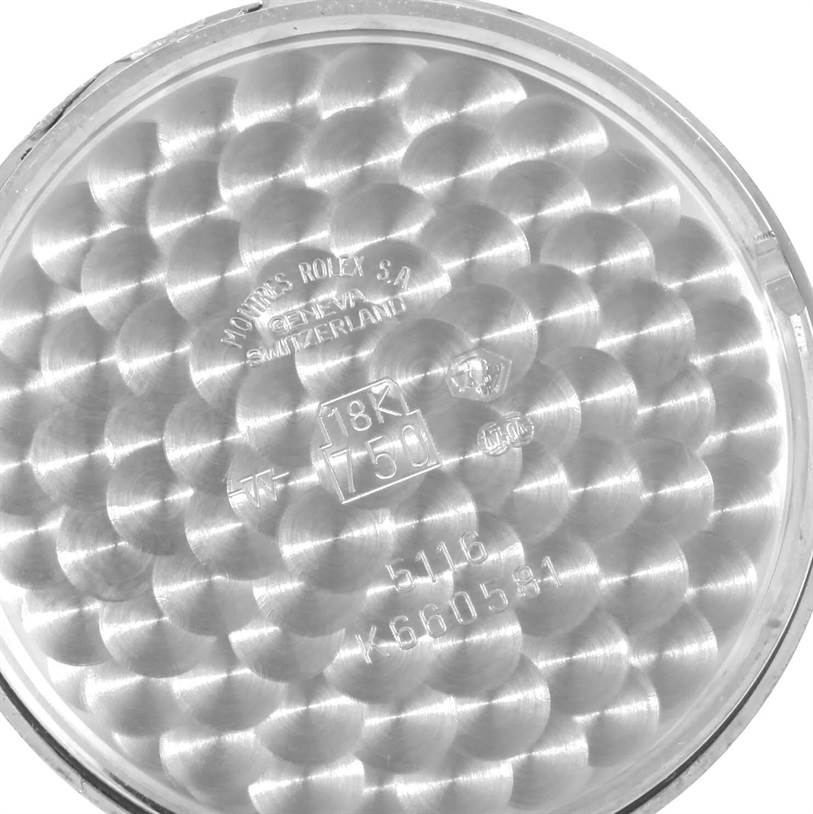 This image shows the inner case back of a Rolex Cellini 5116 Men's White Gold Silver Dial 5116 Men's White Gold Silver Dial model, featuring engravings and a textured pattern.