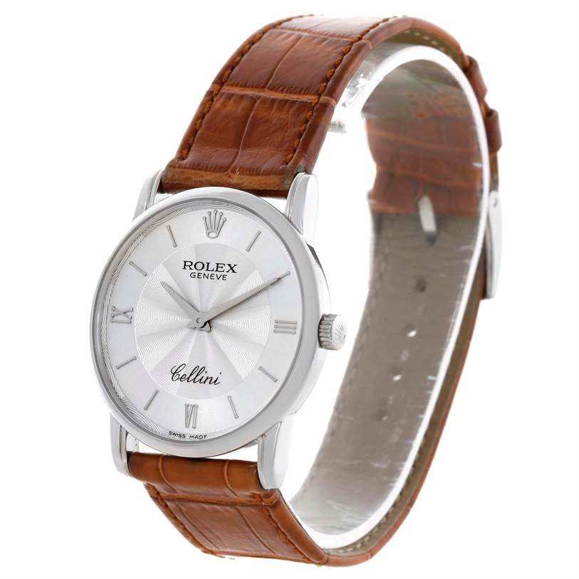 The image shows a Rolex Cellini 5116 Men's White Gold Silver Dial 5116 Men's White Gold Silver Dial watch at a slight angle, highlighting its face, bezel, dial, and brown leather strap.