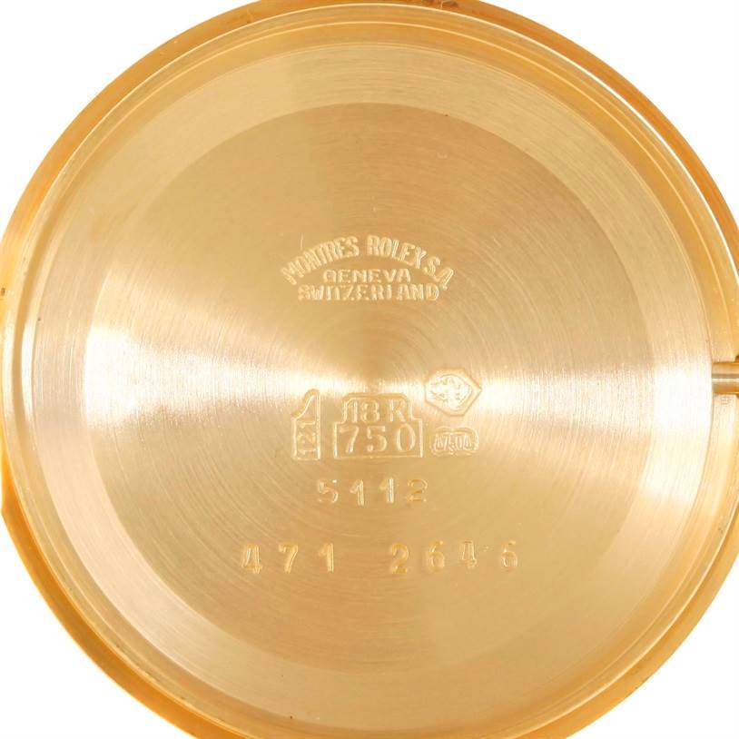 This image shows the inner case back of a Rolex Cellini 5112 Men
s Yellow Gold Champagne Dial 5112 Men
s Yellow Gold Champagne Dial watch in 18K gold, displaying markings and serial numbers.