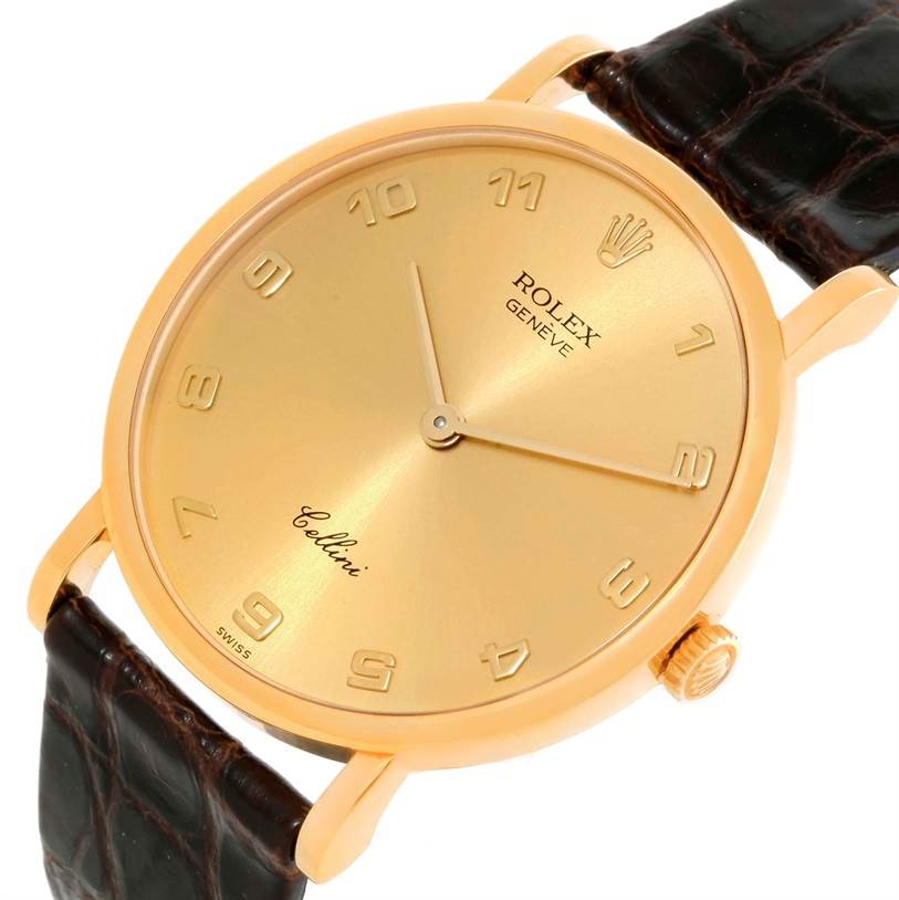 This Rolex Cellini 5112 Men
s Yellow Gold Champagne Dial 5112 Men
s Yellow Gold Champagne Dial watch is shown from a front angle, displaying its gold dial, brown leather strap, and crown.