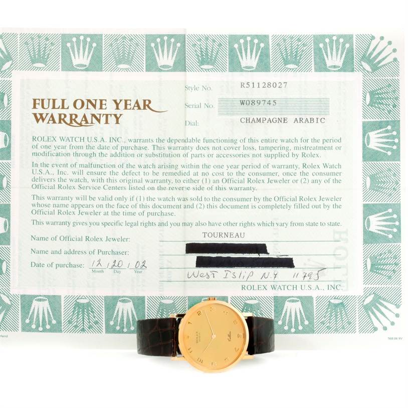 The image showcases a Rolex Cellini 5112 Men
s Yellow Gold Champagne Dial 5112 Men
s Yellow Gold Champagne Dial watch placed in front of its full one-year warranty certificate, taken from a front angle.