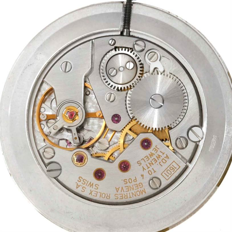 This image shows the internal mechanism of the Rolex Cellini 5112 Men's Yellow Gold Beige Dial 5112 Men's Yellow Gold Beige Dial watch, including gears and jewels, viewed from the back.