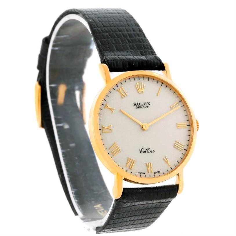 The Rolex Cellini 5112 Men's Yellow Gold Beige Dial 5112 Men's Yellow Gold Beige Dial watch is shown at a three-quarter angle, displaying the dial, case, and black leather strap.