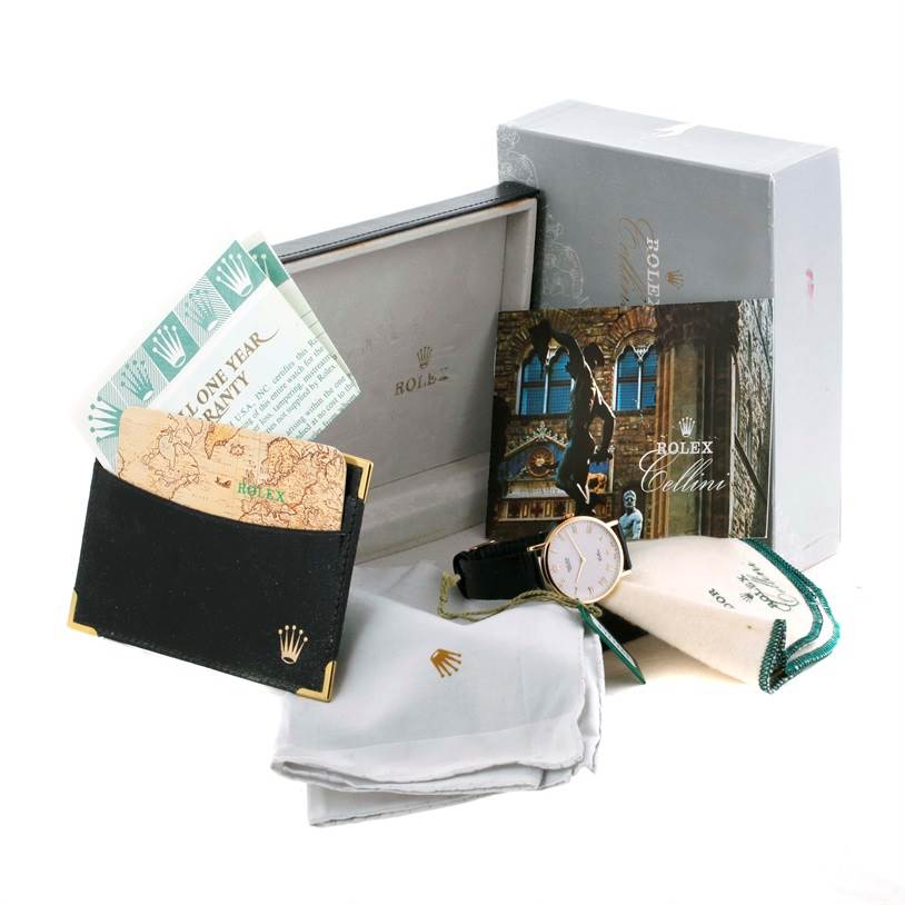 The image shows a Rolex Cellini 5112 Men's Yellow Gold Beige Dial 5112 Men's Yellow Gold Beige Dial watch with its box, warranty, booklet, pouch, and cleaning cloth.