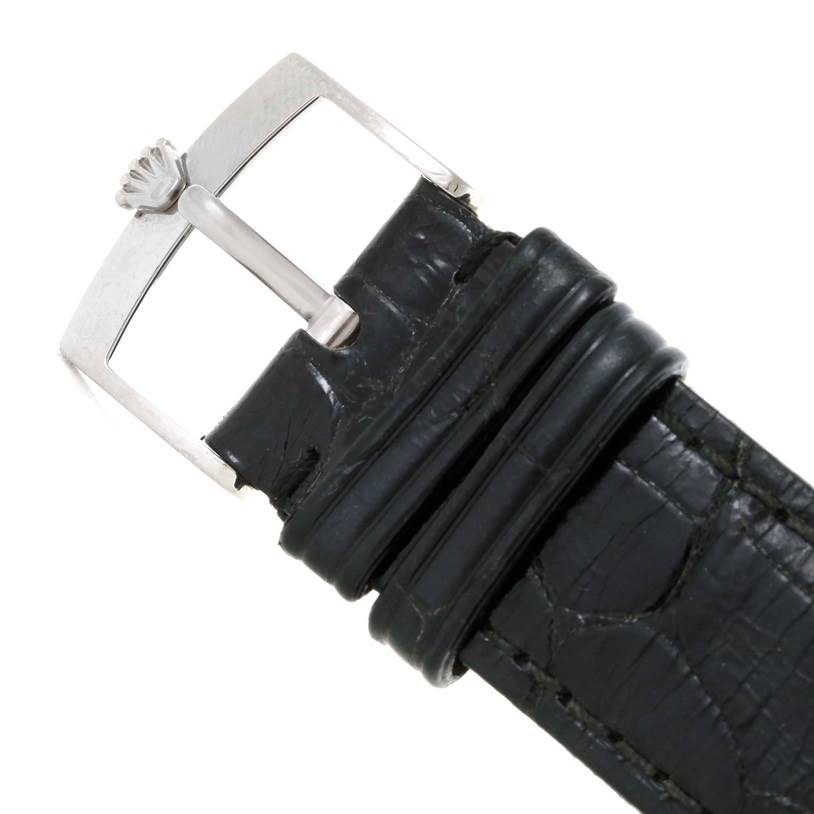 The image shows a close-up of the buckle and strap of a Rolex Cellini 4233 Men's White Gold Black Dial 4233 Men's White Gold Black Dial watch, highlighting the clasp with the Rolex logo.