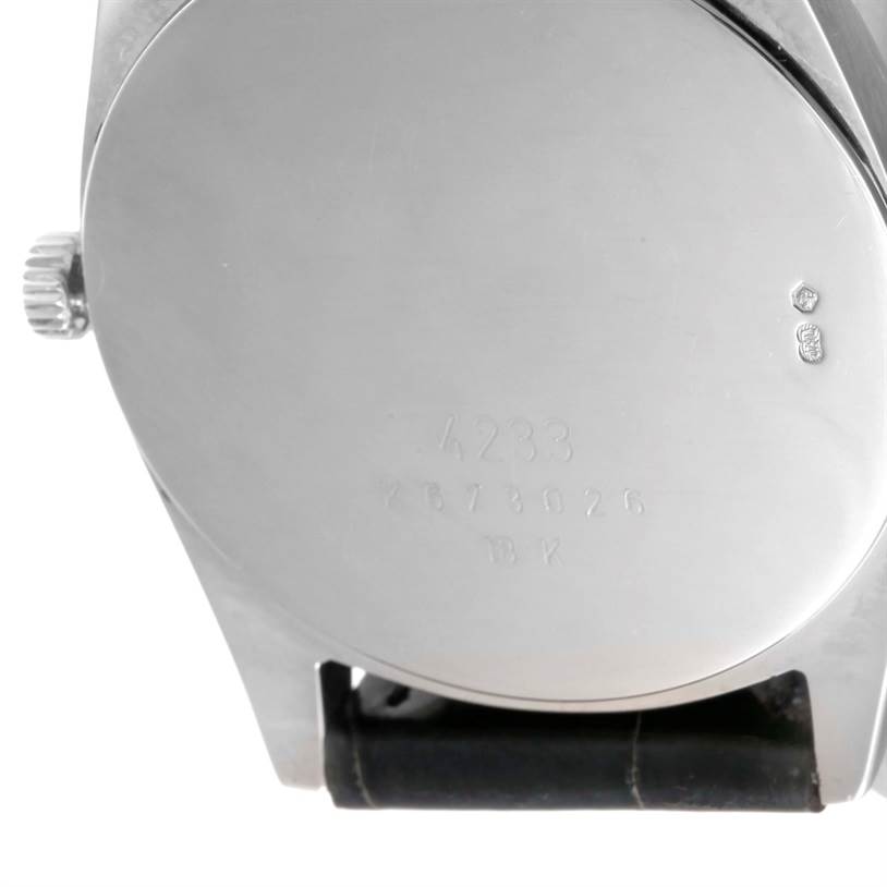 The image shows the back case and crown of a Rolex Cellini 4233 Men's White Gold Black Dial 4233 Men's White Gold Black Dial watch from a rear angle, with part of the leather strap visible.