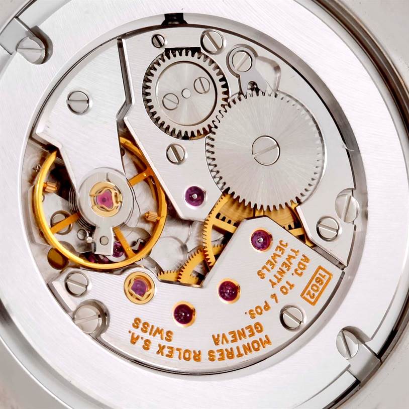 Close-up view of the movement mechanism of the Rolex Cellini 4233 Men's White Gold Black Dial 4233 Men's White Gold Black Dial watch, showing gears and intricate parts.