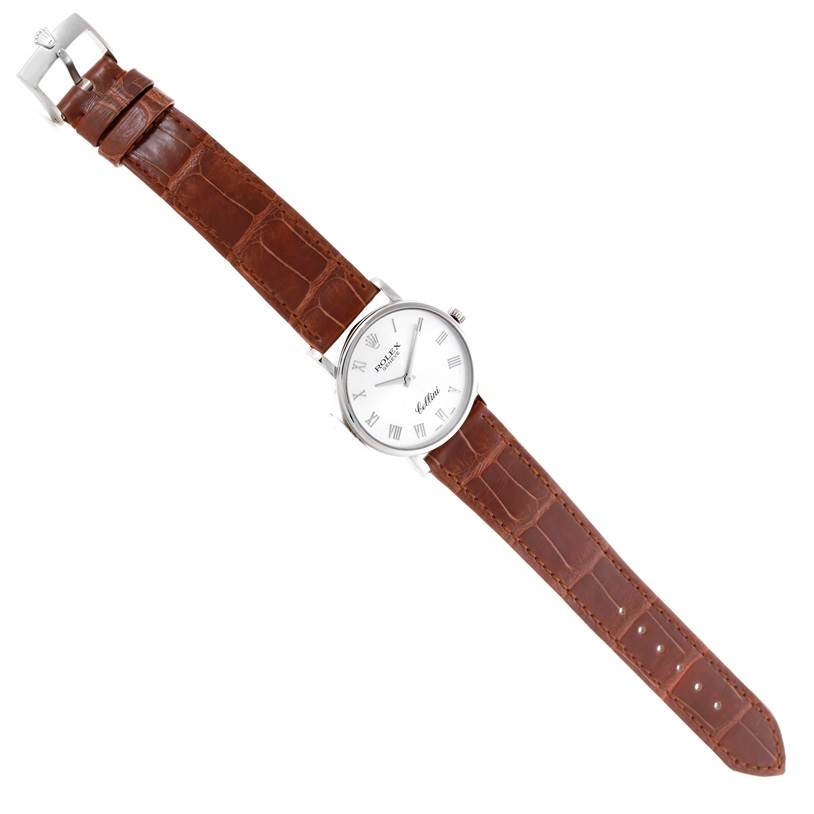 This Rolex Cellini 5115 Men's White Gold Silver Dial 5115 Men's White Gold Silver Dial model watch is shown from a top-down angle, displaying the face, case, crown, and brown leather strap.
