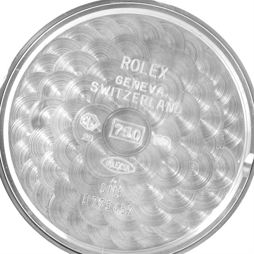 This image shows the interior case back of a Rolex Cellini 5115 Men's White Gold Silver Dial 5115 Men's White Gold Silver Dial watch, featuring the brand's engravings and serial numbers.