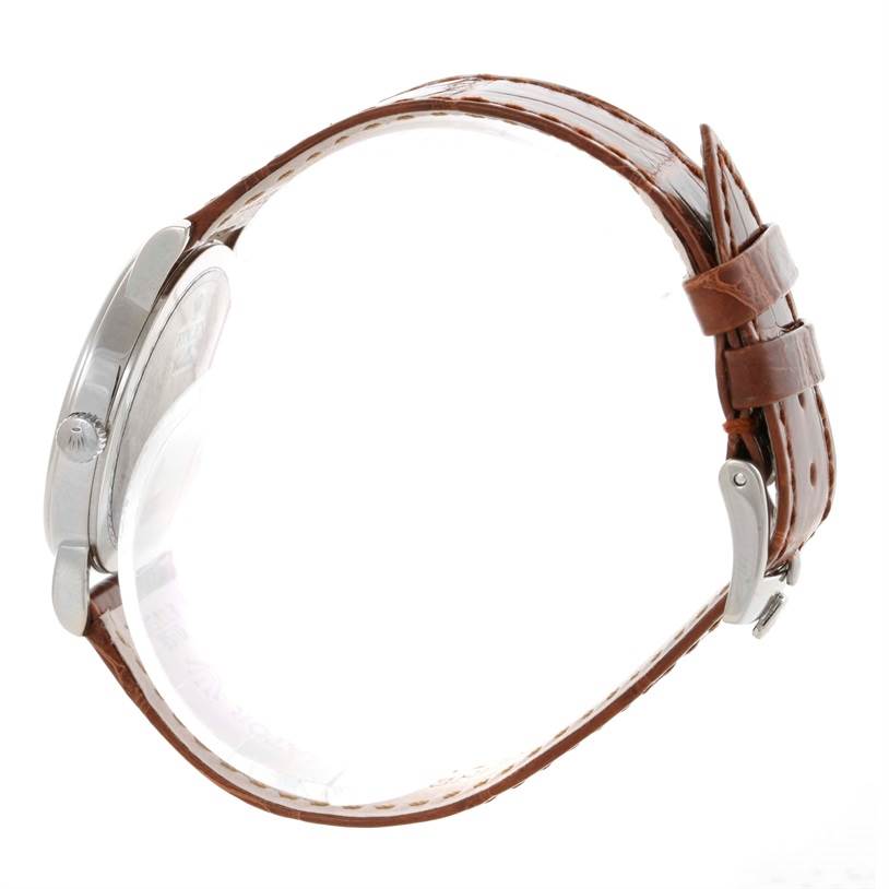 The image shows a side profile of a Rolex Cellini 5115 Men's White Gold Silver Dial 5115 Men's White Gold Silver Dial watch focusing on the case, crown, and brown leather strap.