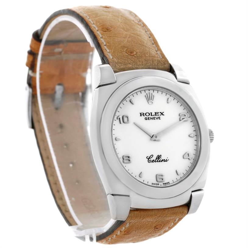 The Rolex Cellini 5330 Men's White Gold White Dial 5330 Men's White Gold White Dial watch is shown at an angle, displaying its face, crown, and brown leather strap.