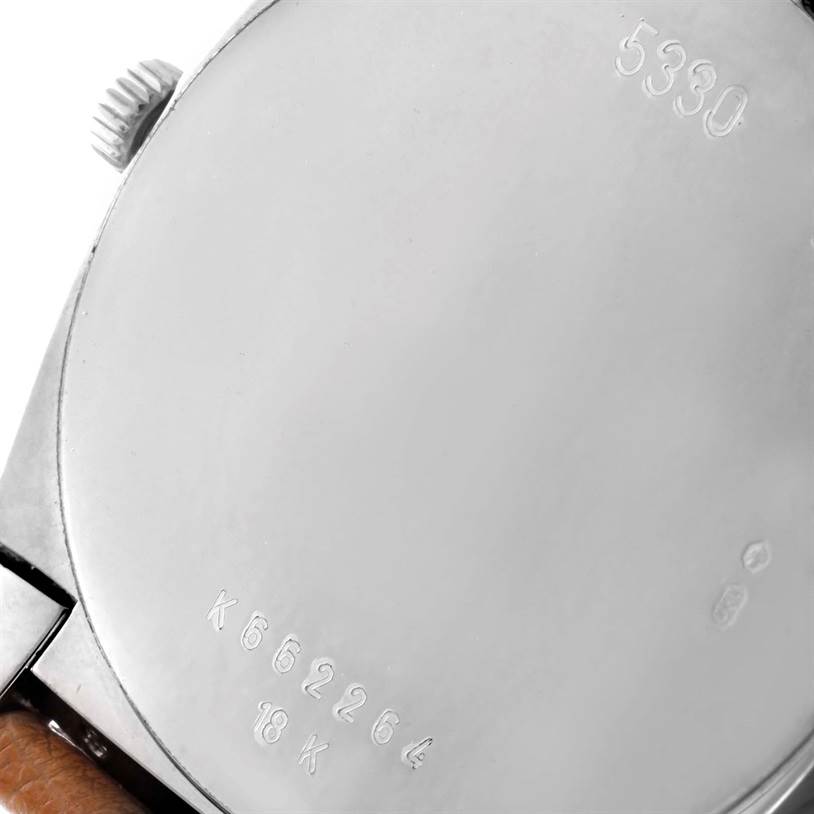 The image shows the case back of a Rolex Cellini 5330 Men's White Gold White Dial 5330 Men's White Gold White Dial watch, with visible engraved numbers and the crown.