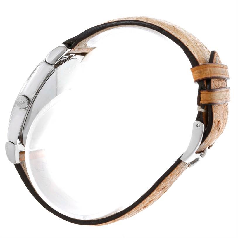 The Rolex Cellini 5330 Men's White Gold White Dial 5330 Men's White Gold White Dial watch is shown from a side angle, highlighting the case, crown, and strap with a visible clasp.