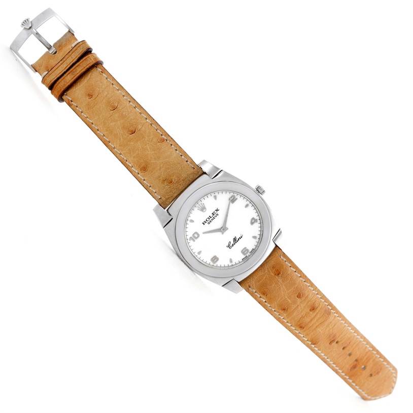 This image shows a top view of a Rolex Cellini 5330 Men's White Gold White Dial 5330 Men's White Gold White Dial watch with a tan leather strap and a silver case.