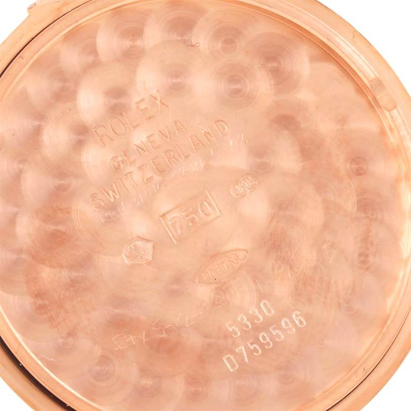 This image shows an interior view of the Rolex Cellini 5330 Men's Rose Gold Grey Dial 5330 Men's Rose Gold Grey Dial watch case back, highlighting engravings and hallmarks.